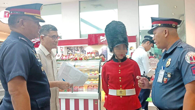 PNP fines guard wearing costume